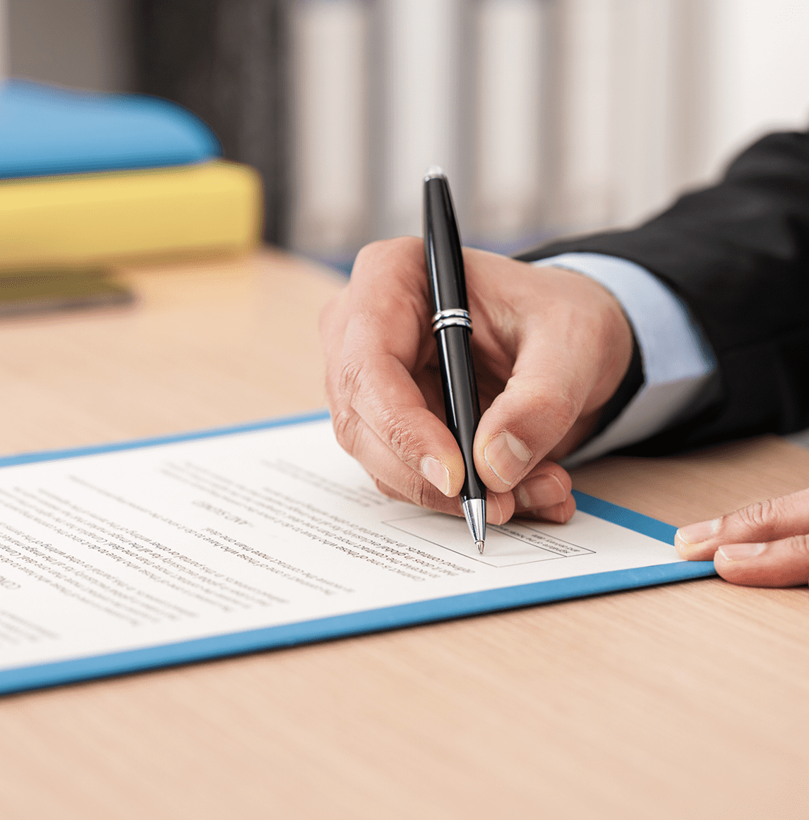Hand writing with pen on desk